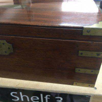 A Mahogany campaign writing slope brass bound with a fitted interior.- NO RESERVE