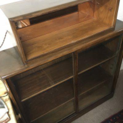 A mahogany cabinet with peach glass mirrored back top shelf, approx 110cm x 30cm x 130cm. NO RESERVE
