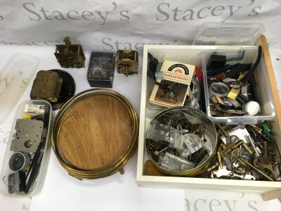 A collection of clock parts and movements.