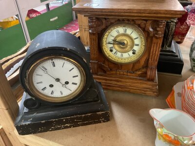 A Victorian slate mantle clock together with two other clocks .