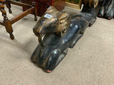 A pair of double ended rams head figures., each 96cm.