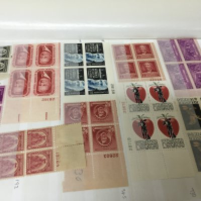 A well presented black album containing a comprehensive collection of American stamps in blocks of four unused many with outer edges.