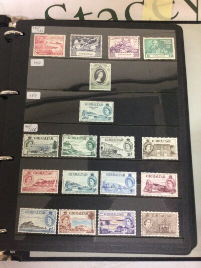 An Album containing well presented unused stamps from Gibraltar Elizabeth II pre decimal and later