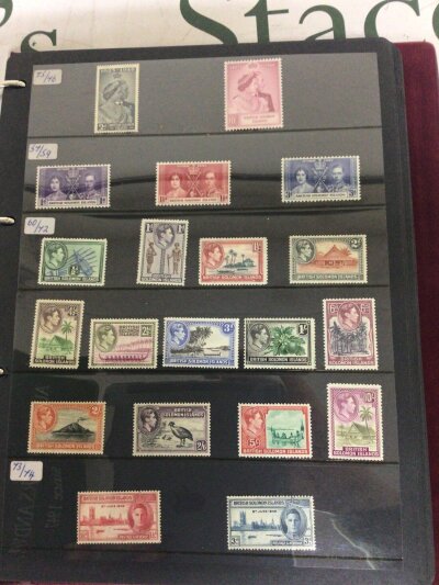 An album containing very well presented stamps mostly unused The British Solomon Islands from George VI and Elizabeth II and Solomon Island stamps.