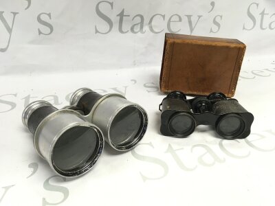 A pair of binoculars and opera glasses