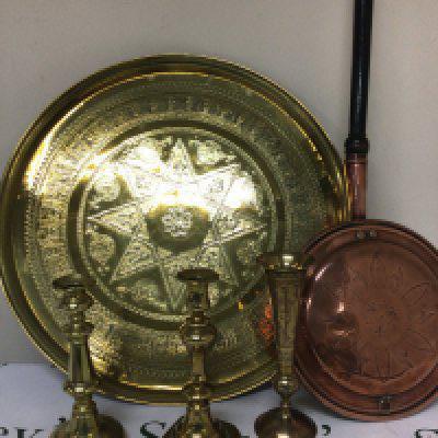 A pair of brass candle sticks a large brass tray and a copper warming pan.- NO RESERVE