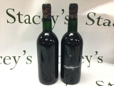 Two bottles of vintage port 1967 , no label, seal reads Peatling & Cawdron. Vendor comments for provenance Greene King , good levels. Thomas Peatling of Bury St Edmunds began a wine and spirit partnership in Wisbech in 1826. By 1830 the firm had expanded to Bedford and St Ives, later becoming Thos. Peatling & Sons. In the early 20th century it grew through acquisitions in King’s Lynn and Wisbech, became agents for Greene King in 1911, joined forces with them in 1934, and later absorbed Herbert Cawdrons of Wells-on-Sea in 1954