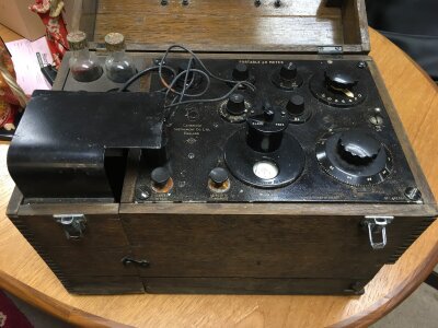 A wooden cased water PH testing kit.