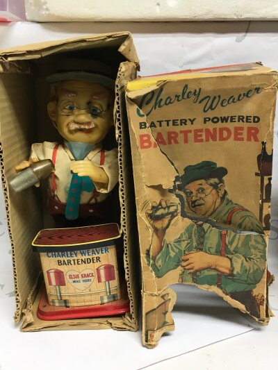 A boxed Charley Weaver Bartender, seen working.