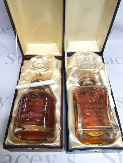 Two boxed cruise liner single malt whisky decanters, both sealed and full.