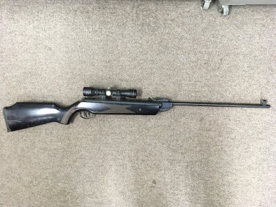 An air gun with a fitted sight.