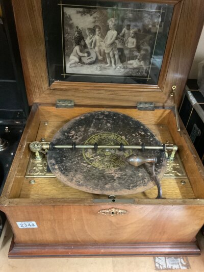 A  Victorian walnut cased symphonion