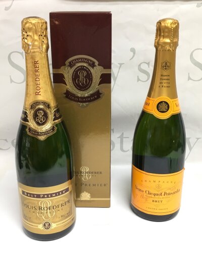 Two bottles of champagne comprising a boxed Louis Roederer and a Veuve Clicquot Ponsardin.