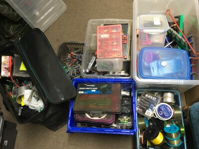 A large collection of fishing tackle including line, hooks, rigs, lures , weights etc