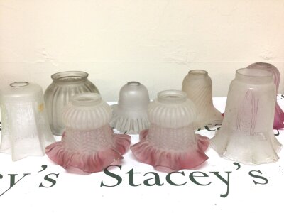 A Collection of antique glass lamp shades including some with cranberry shaped edges and acid etched decoration.