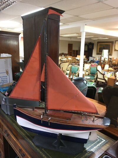 A large model of a sailing boat, approx length 1 metre.