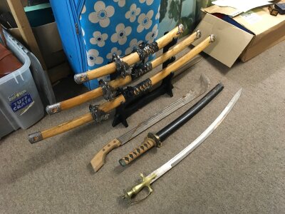 Seven swords including a Japanese katana trio