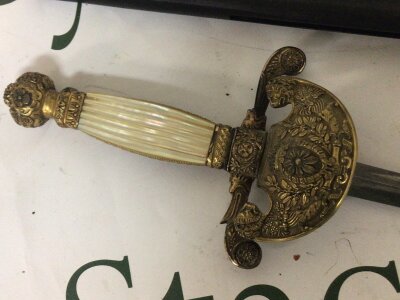 An Italian Court sword with elaborate brass cross guard  partial engraved blade and a replica light spring loaded double barrel under leaver rifle. (2)