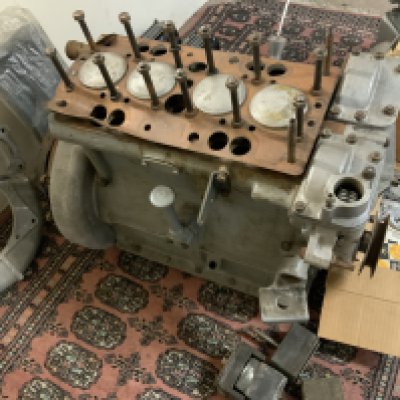 A Classic Car Engine and other accessories including Gearbox an unused sets of  pistons and other accessories The Lea Francis four cylinder engine with applied plates and cast engine block number 75 MC14288 12 2. The Diatto gear box has been withdrawn from this lot and will be sold with the Diatto. 