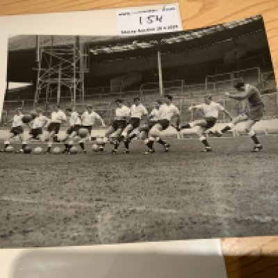 Tottenham Double Winners Signed Football Press Photos: Depicts 11 players all kicking a ball of which 10 have hand signed. Includes Mackay Baker Jones and Brown. 10 x 8 black and white photo with press stamp to rear.