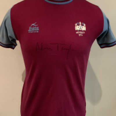 View Index. West Ham 1975 FA Cup Final Football Shirt: Bukta claret and blue shirt worn by double goalscorer Alan Taylor in the famous win over Fulham at Wembley. Bukta Sportswear to one breast and Wembley 1975 to the other underneath embroidered West Ham badge. Excellent condition shirt with number 9 to rear. C/W socks and shorts worn in the match which have heavy yellow age staining. Signed to front by Alan Taylor. Signed COA from Alan Taylor who scored two goals in the quarter final, semi final and final. Going under the hammer only 4 days before the 50th anniversary of this match.