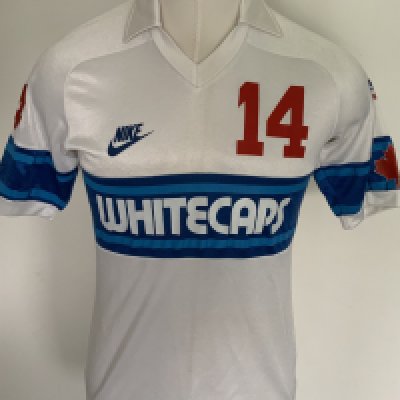 Vancouver Whitecaps 1983 Match Worn Football Shirt: Excellent condition very rare home shirt made by Nike. Number 14 to front rear and sleeves. Both sleeves have the Canadian flag and one had an advert for Super Bowl 83 in Vancouver. Medium size attractive shirt has Taylor to rear