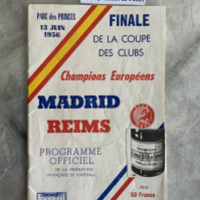 1956 Rare European Cup Final Football Programme: Real Madrid v Reims played in Paris. Good condition with no team changes. Very light cup mark to cover. Champagne bottle sticker as always ripped in order that you can read the programme. C/W tatty France Football paper covering the first ever European Cup final.
