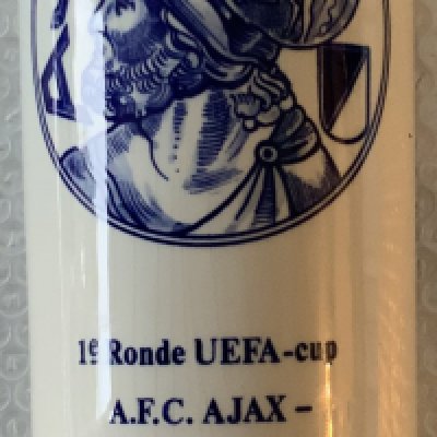 Manchester United 1976 Delft Football Players Gift: Rare very limited edition ceramic large bottle. Made by famous maker Delft for Manchester United touring party for the UEFA Cup match Ajax v Manchester United on 15 9 1976. Match details and date to item with the Ajax logo and Jonge Bols sticker. Ltd edition pieces are rare from this maker. Cork is stuck in the neck which may have had a different top. Beautiful piece measuring just over a foot high.