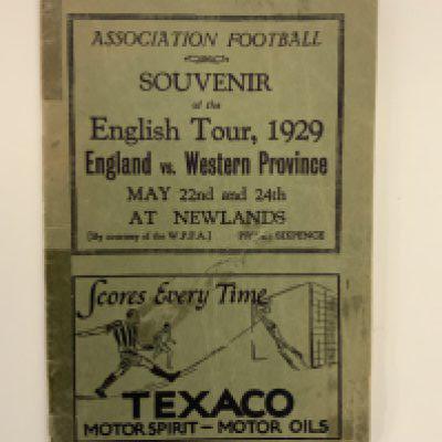 1929 English FA Tour To South Africa Guide Book: 22 page guide listing fixtures and English players touring etc. Back page has strip missing not affecting any text. There is tape also. Unusual item.