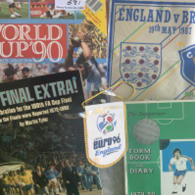Football Memorabilia Box: 79/80 Sigma Sports cards celotaped into album, 1987 England v Brazil pennant, Small Euro 96 pennant, FDCs, Italy World Cup complete coin set, empty wine bottles for World Cups 1990 + 1998 and a book. Instructions to sell.
