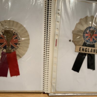 1966 England World Cup Rosette Collection: 12 different rosettes with many featuring the Jules Rimet trophy or World Cup Willie. Housed nicely in collectors folder. (12)