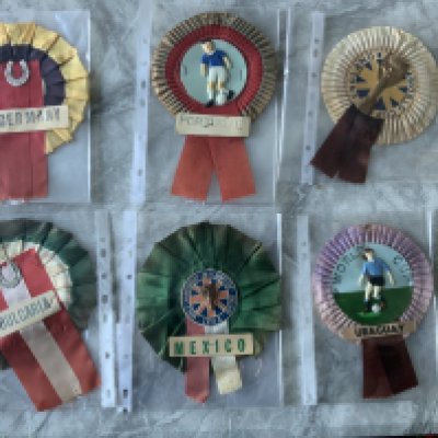 1966 World Cup Football Rosettes: England Uruguay and Mexico actually state a World Cup with two having the Jules Rimet trophy. Bulgaria West Germany and Portugal are of the period but do not state World Cup. Good. (6)
