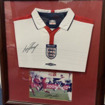 Wayne Rooney Signed Framed England Shirt: White home replica shirt and a photo of him playing wearing this style shirt both of which are hand signed. COA from Everton. Not for posting.