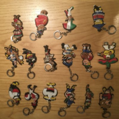 1966 World Cup Finals Teams Football Key Rings: Very rare full set of 16 countries made in Europe of stereotypical caricatures on quality padded key rings. England is represented by World a cup Willie. Excellent original condition for nearly 60 years old. (16)