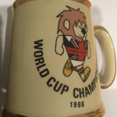 1966 World Cup Willie Football Tankard: Stunning ceramic tankard with gold edging still in excellent condition which is unusual. Gibsons of Stoke to base.
