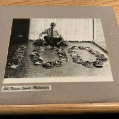 Bobby Charlton England Caps Football Photo: Photo in mount of Charlton with his caps in the shape of the number 100 to celebrate his hundredth cap. Original photo by Bob Thomas is 8 x 6 inches and attached to larger mount.