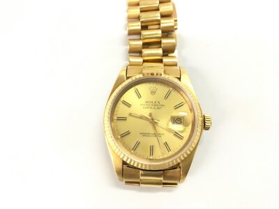 A Rolex Datejust in 18ct gold with baton numerals and date aperture. Seen working. No box or papers.