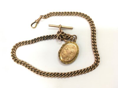 A 9ct gold Albert chain and locket, approx total weight 58.8g.