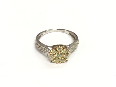 A 9ct yellow and white gold dress ring set with princess cut and RBC diamonds, approx 0.25ct. Approx 3.2g and approx size S.