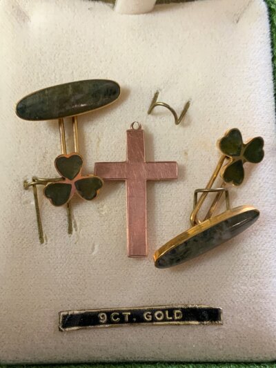 A pair of 9ct gold and jade set cufflinks together with a 9ct gold cross pendant.