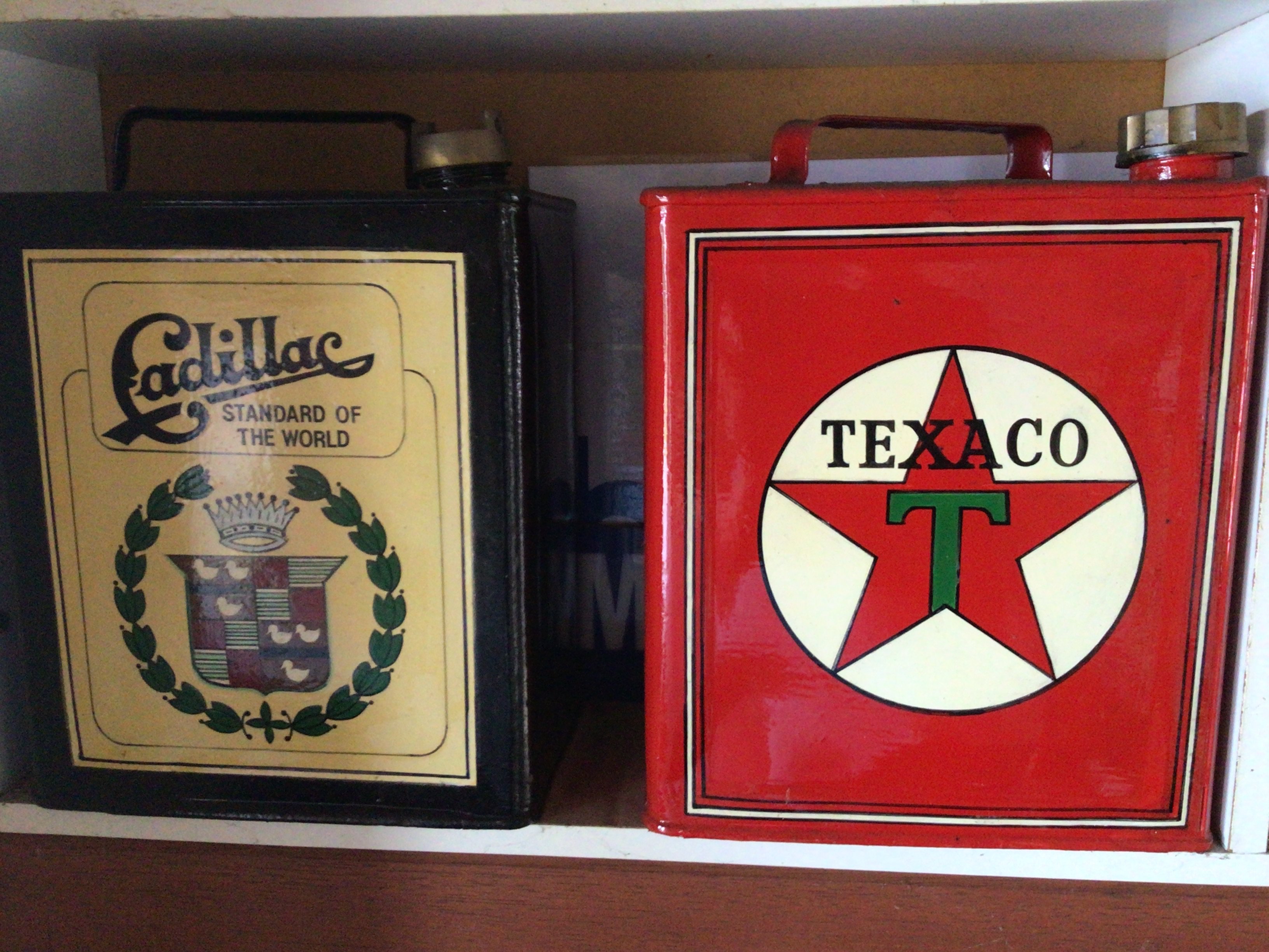 Two hand painted Vintage Cadillac standard of the world and Texacocans. (2)