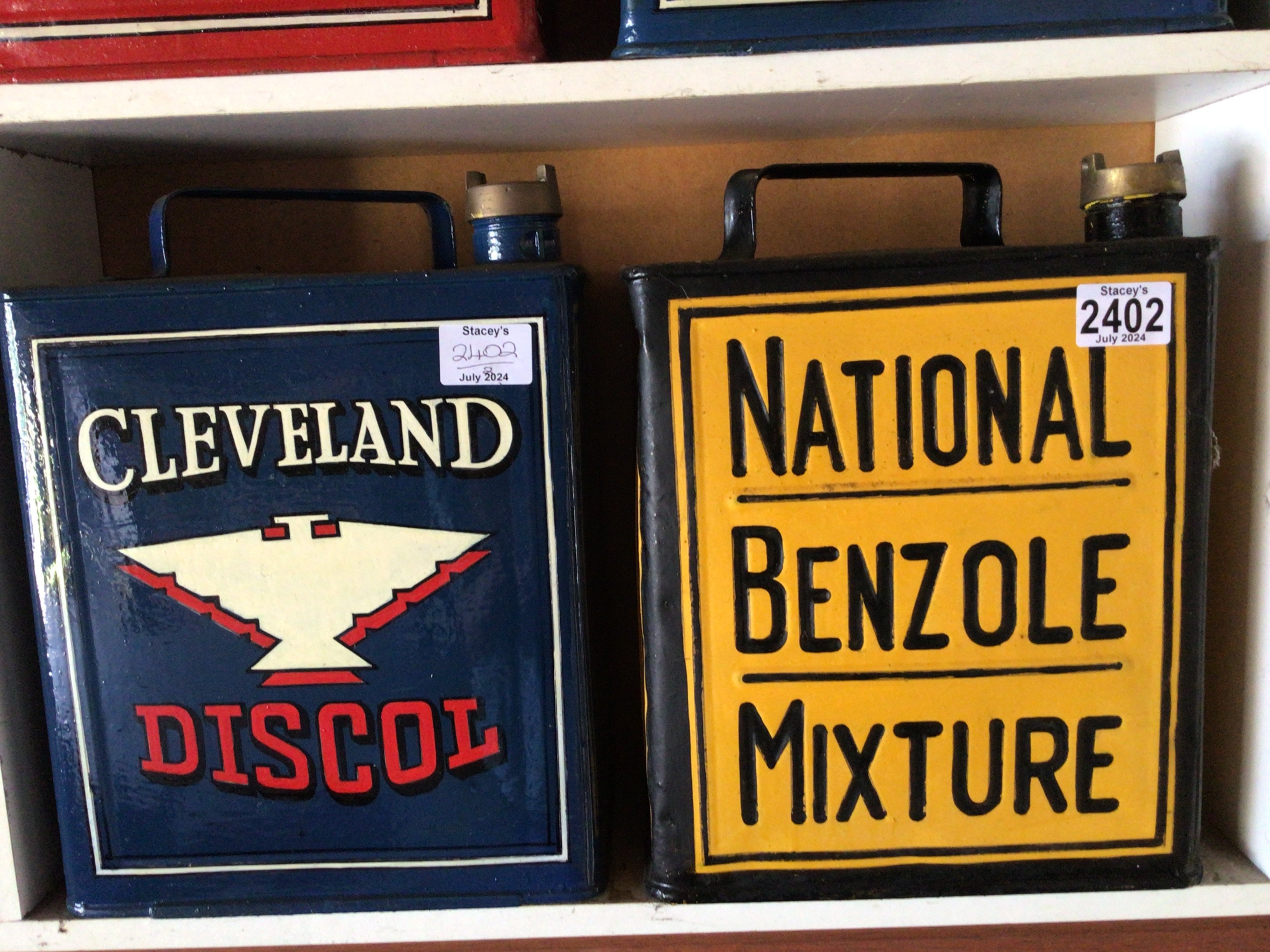 Two hand painted Vintage Cleveland Discol and National Benzole Mixture petroleum cans. (2)