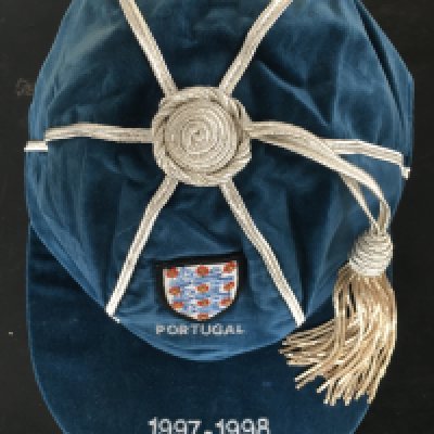 Paul Merson 1998 England Football Cap: Issued to Merson for playing v Portugal in a Full International on 22 4 1998. Excellent condition with embroidered 3 Lions badge and the word Portugal underneath. Peak states 1997-1998. Players name written on tag inside.