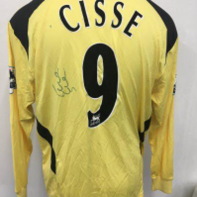 Liverpool 2004 - 2005 Cisse Match Worn Football Shirt: Long sleeve yellow Carlsberg Reebok shirt. Cisse number 9 and undedicated signature to rear. Possible 3rd shirt for following season.