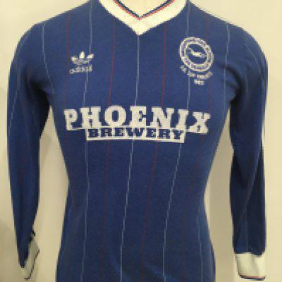 Brighton 83/84 Match Worn Home Football Shirt: Number 2 long sleeve pinstriped blue Adidas shirt. Under the Brighton breast badge are the words FA Cup Finalists 1983. Excellent condition rare shirt worn by Chris Hutchins who joined in this season and eventually played 153 times for Brighton.