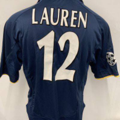 Arsenal 2001 - 2002 Match Worn Football Shirt: Short sleeve blue 3rd kit with Champions League badging to sleeve. Lauren number 12 to rear. Dreamcast sponsor. Signed COA stating I wore this shirt v Real Mallorca on September 11th 2001 a historic day in history.