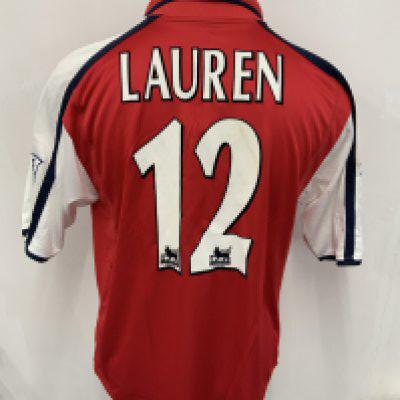 Arsenal 2001 - 2002 Match Worn Home Football Shirt: Short sleeve red home kit with Premier League badging to sleeves. Goalscorer Lauren with his number 12 to rear. Dreamcast sponsor. Signed COA stating I wore this shirt v Tottenham on April 6th 2002.