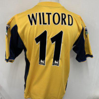 Arsenal 2000 - 2001 Match Worn Away Football Shirt: Short sleeve yellow away kit with Premier League badging to sleeve. Wiltord number 11 to rear. Sega sponsor. Signed COA stating I wore this shirt v West Ham on October 21st 2000. Fully signed to front by team mates.