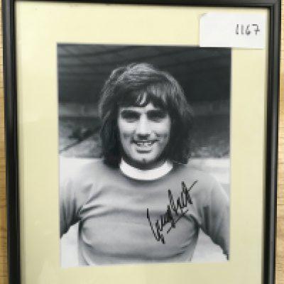 George Best Manchester United Signed Framed Photo: Black and white photo of Best hand signed without dedication and nicely framed. Rear has Coa attached signed by member of the UACC.