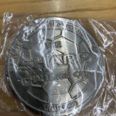 1999 Manchester United In Australia Football Medal: Just after winning the treble this boxed large heavy metal medal is in original box. Reads Manchester United v Australia The Sharp Challenge Cup July 1999.